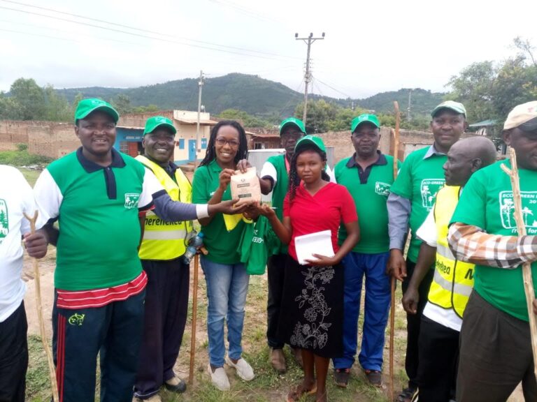 Madam Mbenge gifting EGI with Seedballs 21 Dec 2019 1