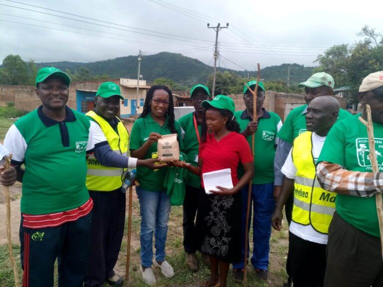 Madam Mbenge gifting EGI with Seedballs 21 Dec 2019